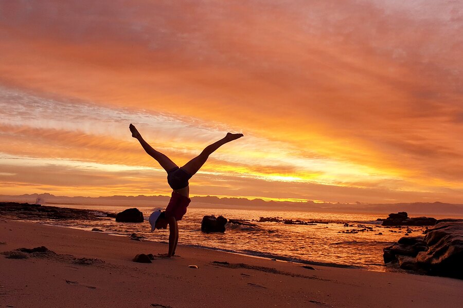 Handstand at sunrise, Muizenberg, South Africa, 2023